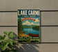 A vintage-style sign for Lake Carmi State Park in Vermont, featuring a scenic image of a lake, mountains, and a canoe.