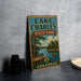 A vintage-style sign for Lake Charles State Park in Arkansas, featuring a scenic illustration of a lake surrounded by pine trees and mountains.