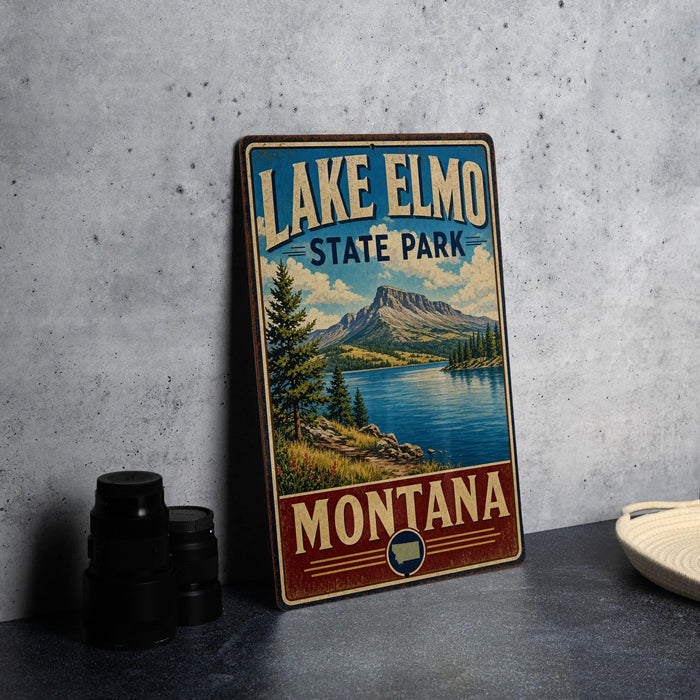 A vintage-style sign for Lake Elmo State Park in Montana, featuring a scenic landscape with mountains, a lake, and pine trees.