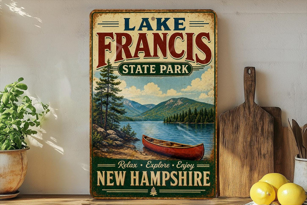 A vintage-style sign for Lake Francis State Park in New Hampshire, featuring a scenic image of a lake, mountains, and a canoe.