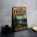 A vintage-style metal sign for Lake Francis State Park in New Hampshire, featuring a scenic image of a lake with a canoe and mountains in the background.