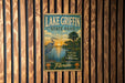 A vintage-style sign for Lake Griffin State Park in Florida, featuring a seagull and palm trees, is displayed on a wooden wall.