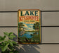 A vintage-style metal sign for Lake Kissimmee, Florida, featuring a scenic illustration of the lake, palm trees, and a bird.
