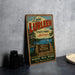 A vintage-style sign for Lake Lurry State Park in Alabama, featuring a scenic illustration of the park's natural surroundings.