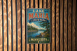 A vintage-style sign for Lake Maria State Park in Minnesota, featuring a scenic landscape with a lake, mountains, and pine trees.