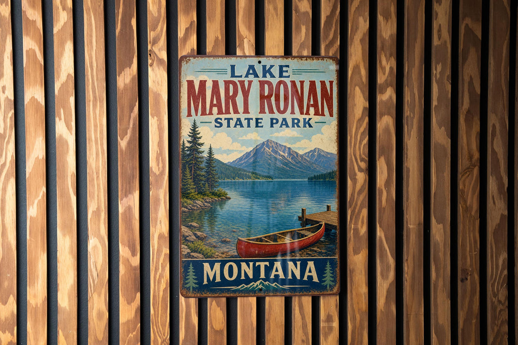A vintage metal sign for Lake Mary Ronan State Park in Montana, featuring a scenic image of a lake, mountains, and a red canoe.