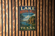 A vintage-style metal sign for Lake Mineral Wells State Park in Texas, featuring a scenic landscape with a lake, cliffs, and trees.