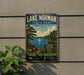 A vintage-style metal sign for Lake Norman State Park in North Carolina, featuring a scenic image of a lake, trees, and a sailboat.