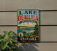 A vintage-style metal sign for Lake Ogallala, a state recreation area in Nebraska, featuring a boat and a scenic landscape.