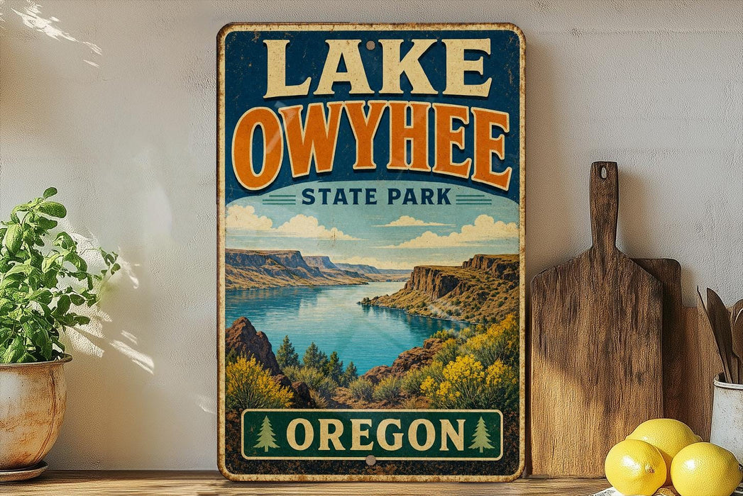 A vintage-style sign for Lake Owyhee State Park in Oregon, featuring a scenic landscape with mountains, water, and greenery.