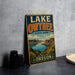 A vintage-style sign for Lake Owyhee State Park in Oregon, featuring a scenic landscape with mountains, water, and greenery.