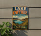 A vintage-style sign for Lake Owyhee State Park in Oregon, featuring a scenic landscape with mountains, water, and greenery.