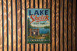 A vintage metal sign for Lake Shetek State Park in Minnesota, featuring a scenic illustration of the park and its surroundings.