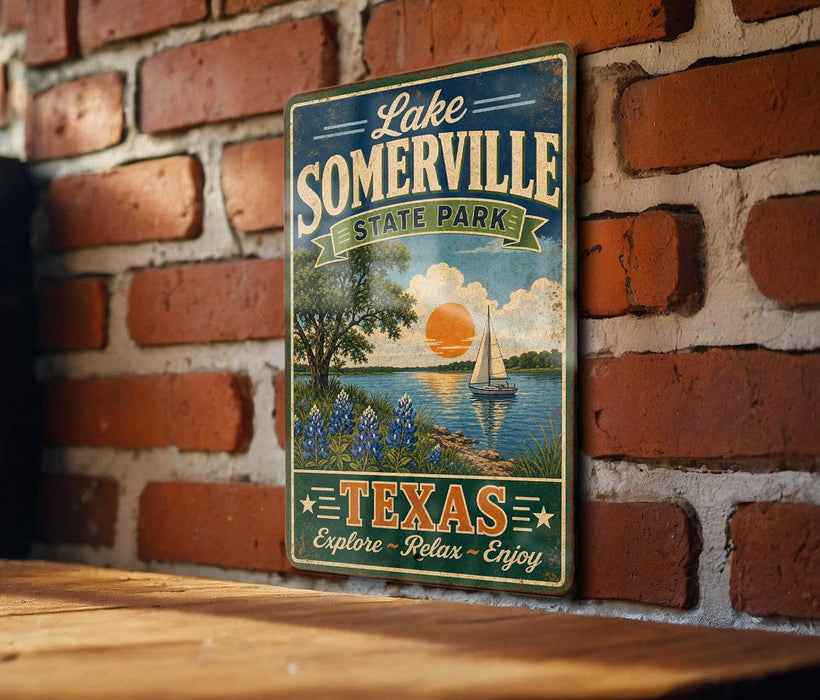 A vintage-style sign for Lake Somerville State Park in Texas, featuring a scenic illustration of a lake, a sailboat, and a sunset.