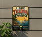 A vintage-style metal sign for Lake Texoma State Park in Oklahoma, featuring a sailboat on a lake and a sunset in the background.