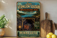 A vintage-style metal sign advertising Lake Vermilion-Soudan, Minnesota's Underground Mine State Park, with a scenic illustration of a cave, lake, and forest.