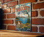 A vintage-style sign for Lake Walcott State Park in Idaho, featuring a scenic landscape with mountains, a lake, and a sign for Idaho.