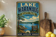 A vintage-style sign for Lake Waramaug State Park in Connecticut, featuring a scenic landscape with a lake, pine trees, and a sailboat.
