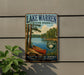 A vintage-style sign for Lake Warren State Park, featuring a scenic image of a lake, trees, and a canoe, mounted on a wall.