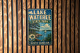 A vintage-style sign for Lake Wateree State Park in South Carolina, featuring a scenic illustration of a lake, trees, and a sailboat.