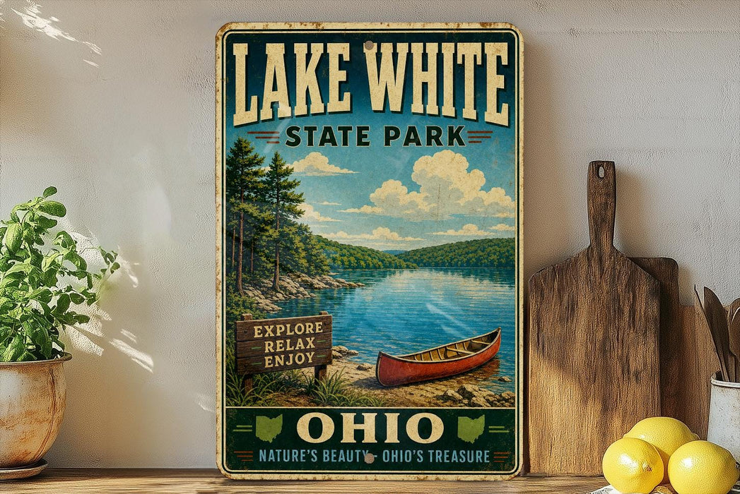 A vintage-style sign for Lake White State Park in Ohio, featuring a scenic image of a lake, pine trees, and a canoe.