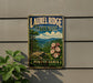 A vintage-style metal sign for Laurel Ridge State Park in Pennsylvania, featuring a scenic landscape with mountains, trees, and flowers.