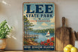 A vintage-style sign for Lee State Park in South Carolina, featuring a scenic image of a lake, pier, and sailboat, along with the text "Lee State Park" and "South Carolina".