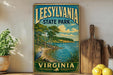 A vintage-style sign for Leesville State Park in Virginia, featuring a scenic landscape with a lake, trees, and a bird.