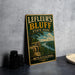 A vintage-style metal sign for Leffeur's Bluff State Park in Mississippi, featuring a scenic landscape with a river and cliffs.