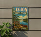 A vintage-style metal sign for Legion State Park in Mississippi, featuring a scenic illustration of a lake, trees, and a canoe.