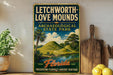 A vintage-style sign for Letchworth-Love Mounds, an archaeological state park in Florida, featuring a scenic landscape with palm trees and hills.