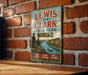 A vintage-style metal sign for Lewis and Clark State Park in Iowa, featuring illustrations of the park's scenic beauty and adventure.