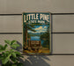 A vintage metal sign for Little Pine State Park in Pennsylvania, featuring a scenic landscape with pine trees, a lake, and mountains.