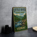 A vintage-style metal sign for Little River State Park in Vermont, featuring a scenic illustration of a river surrounded by mountains and pine trees.