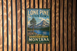 A vintage-style metal sign for Lone Pine State Park, featuring a scenic mountain landscape and a pine tree.