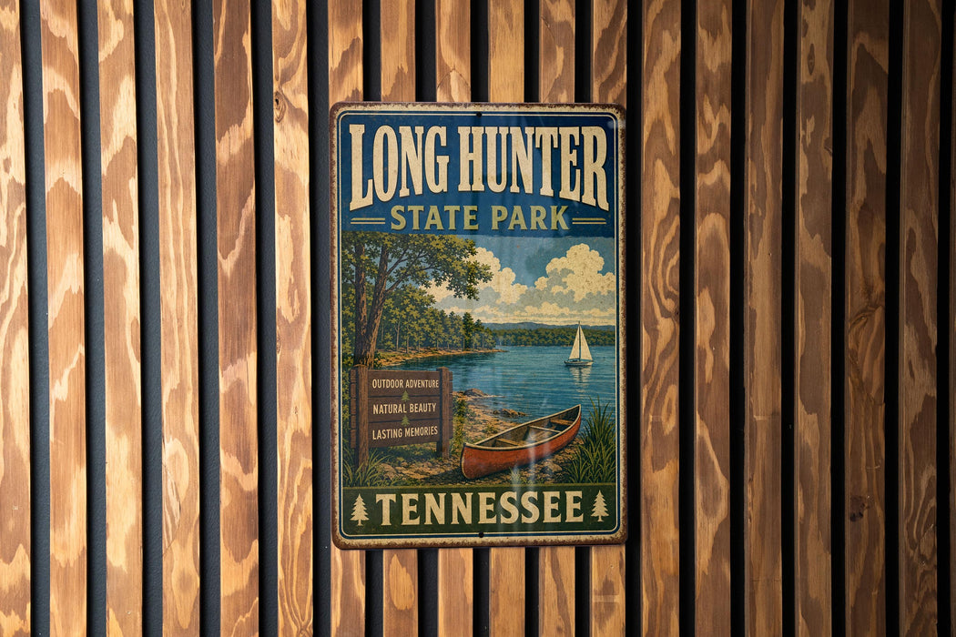 A vintage metal sign for Long Hunter State Park in Tennessee, featuring a scenic illustration of a lake, trees, and a sailboat.