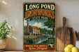 A vintage-style sign for Long Pond Ironworks State Park in New Jersey, featuring an illustration of a stone building and a river.