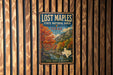 A vintage-style metal sign for Lost Maples State Natural Area in Texas, featuring a scenic landscape with trees and a river.