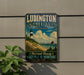 A vintage-style metal sign for Ludington State Park in Michigan, featuring a lighthouse and beach scene.