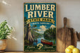A vintage-style sign for Lumber River State Park in North Carolina, featuring a scenic illustration of a river, trees, and a canoe.