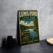 A vintage-style sign for Lums Pond State Park in Delaware, featuring a scenic illustration of the pond surrounded by nature and wildlife.