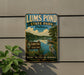 A vintage-style metal sign for Lums Pond State Park in Delaware, featuring a scenic landscape with a lake, trees, and a bird.