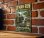 A vintage-style metal sign for the Lymans Run State Park in Pennsylvania, featuring a scenic image of a waterfall surrounded by lush greenery.