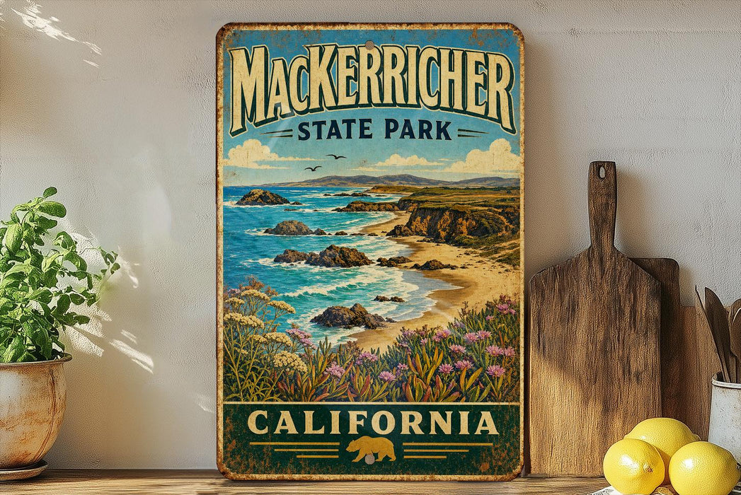 A vintage-style metal sign for Macker richer State Park in California, featuring a scenic coastal landscape with rocky cliffs, a beach, and a blue sky with clouds.