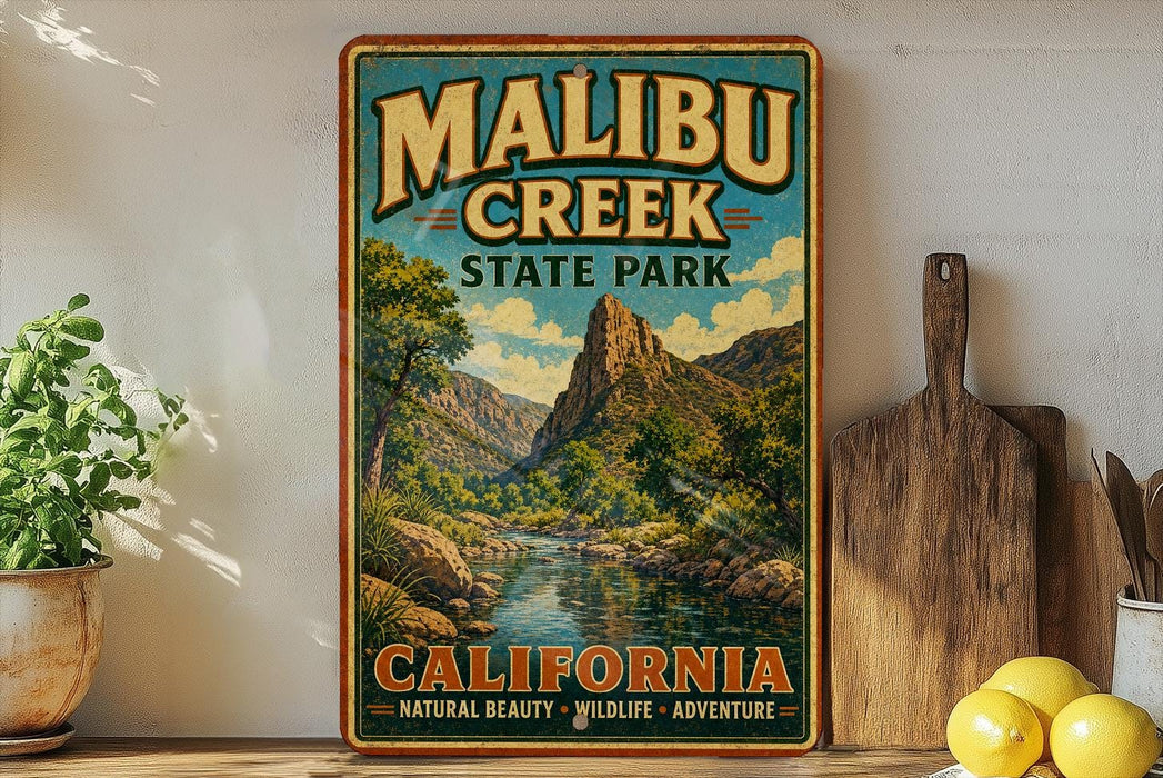 A vintage-style poster of Malibu Creek State Park in California, featuring a scenic mountain landscape with a river and lush vegetation.