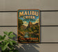 A vintage metal sign for Malibu Creek State Park in California, featuring a scenic landscape with mountains, water, and greenery.