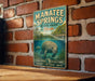 A vintage-style metal sign for Manatee Springs State Park in Florida, featuring an illustration of a manatee swimming in a pond surrounded by lush greenery.