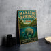 A vintage-style metal sign for Manatee Springs State Park in Florida, featuring an illustration of a manatee swimming in the water.