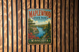 A vintage-style metal sign for Maplewood State Park in Minnesota, featuring a scenic landscape with a lake, mountains, and autumn foliage.