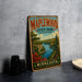 A vintage-style metal sign for Maplewood State Park in Minnesota, featuring a scenic landscape with a lake and forest.